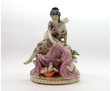 A 20th Century Dresden Model of a female figure with attendants cherubs and doves, raised on a plinth base, decorated through