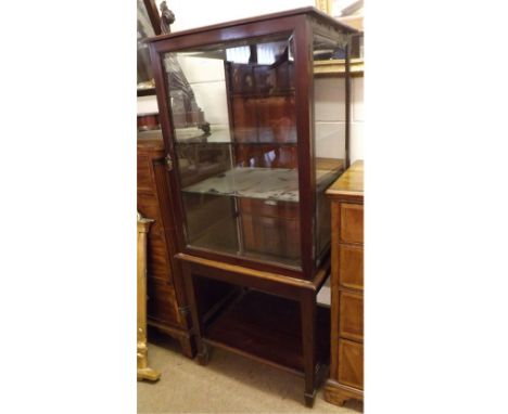 An Edwardian Mahogany Framed Glazed Display Cabinet of rectangular form, the interior with two heavy glass shelves and furthe