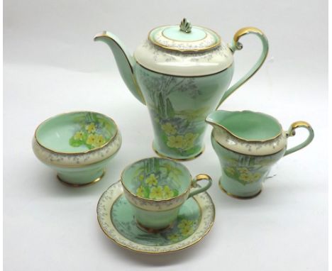 An Aynsley Coffee Set, pattern number B6369/2, decorated with primroses, comprising Coffee Pot, Sugar Basin, Cream Jug, and f