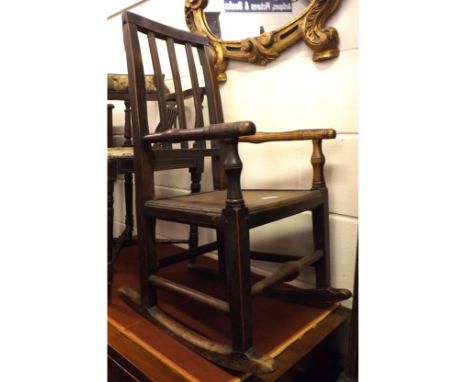 A 19th Century Child's Oak and Elm Rocking Chair with stick back (some repairs), 1ft 4" wide  