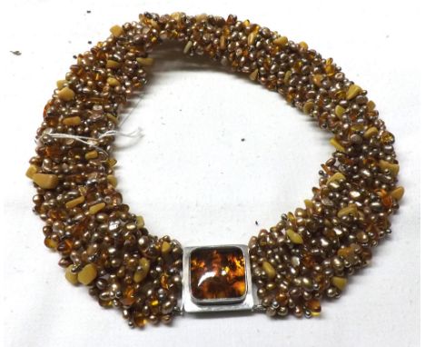 An unusual white metal, Amber and coloured Freshwater Pearl Choker with amber mounted clasp  