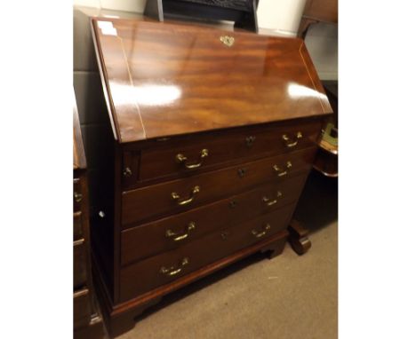 Georgian Mahogany Bureau of typical form, fall front revealing an interior of small drawers, pigeonholes, and central door, t