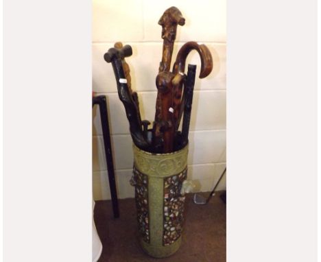 A Stick Stand containing an assortment of various British and Ethnic Walking Sticks