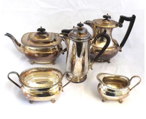 Four piece Silver Plated Tea Set comprising Tea Pot and Hot Water Jug with ebonised handles, together with Cream Jug and Suga