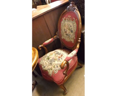 Victorian Mahogany framed tapestry upholstered Armchair, the arch back to a sprung seat with serpentine front, raised on shor