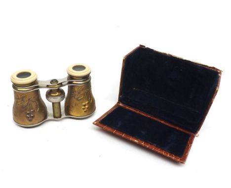 Cased pair of opera glasses or small binoculars, the body decorated with stylised birds amongst foliage, fitted in a plush li