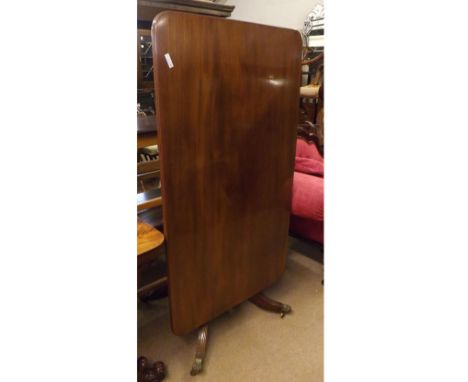 Mahogany pedestal Breakfast Table, the rectangular tilt top with ribbed edge raised on a heavy turned pedestal and quatre bas