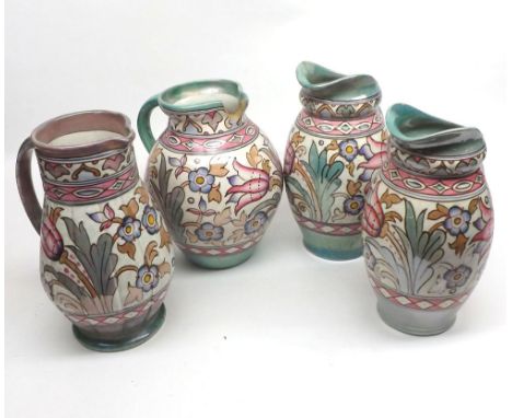 Mixed lot: four Bursley ware Charlotte Rhead Jugs decorated with stylised foliage (1 A/F), largest 9" high&nbsp;
Condition:
A