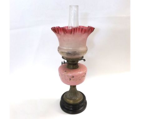 Victorian Oil Lamp with clear glass chimney, frosted Cranberry tinted frilled shade, opaque pink glass font and a Brass base,