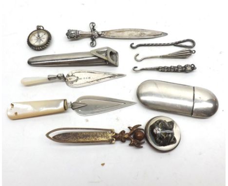 A Mixed Lot comprising: a George V oval Needle Holder with push-on lid, 2 1/2" long, Birmingham 1915; a late Victorian Silver