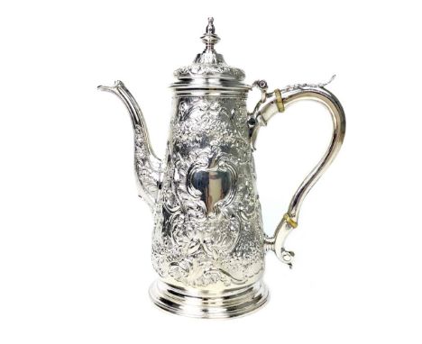 GEORGE III SILVER COFFEE POT, maker Ayme Videau, London 1751, the tapering body embossed with scrolls, foliage and flower hea