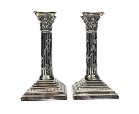 PAIR OF VICTORIAN SILVER CORINTHIAN PILLAR CANDLESTICKS, maker Harrison Brothers &amp; Howson, Sheffield 1897, on stepped, sq