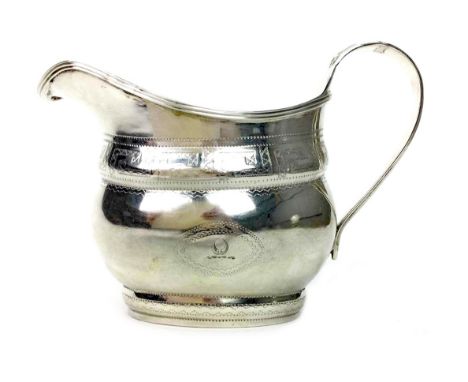 IRISH GEORGE III SILVER CREAM JUG, maker rubbed ('R'...), Dublin 1806, bulbous body stipple engraved with two lozenge cartouc