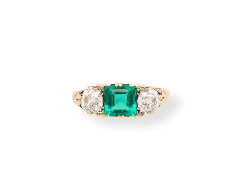 VICTORIAN EMERALD AND DIAMOND RING, 1890s set with a square emerald set between two old mine-cut diamonds, with rose-cut diam