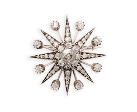 VICTORIAN DIAMOND BROOCH/PENDANT. 1890s designed as an eight pointed star set with old mine-cut diamonds accented with rose-c