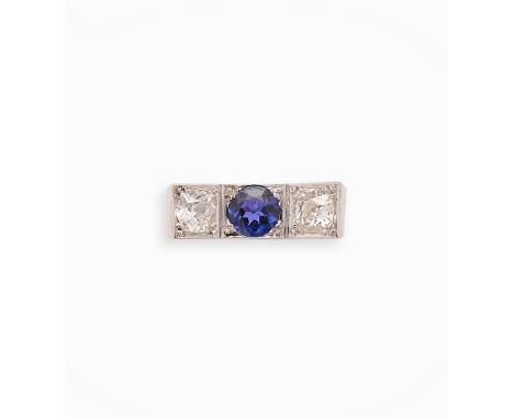 SAPPHIRE AND DIAMOND COCKTAIL RING, 1950s centring on a circular-cut sapphire set between two old mine-cut diamonds, ring siz