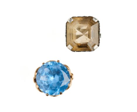 TWO GEM-SET DRESS RINGS, 1960s comprising one claw set with a circular synthetic blue spinel to a scroll work mount, stamped 