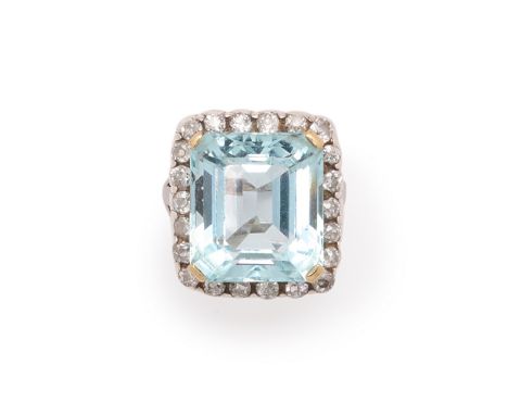 AQUAMARINE AND DIAMOND RING, 1950s/COMPOSITE cluster design, claw set with a rectangular cut-cornered aquamarine, within a be
