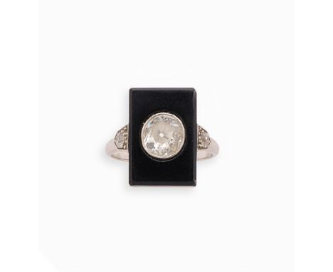 ART DECO DIAMOND RING, 1920s the rectangular onyx bezel inset with an old mine-cut diamond, with diamond accents to the shoul