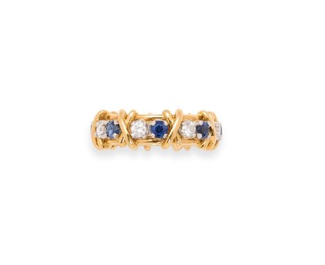 TIFFANY & CO, SCHLUMBERGER: SAPPHIRE AND DIAMOND ETERNITY RING set with circular-cut sapphires and brilliant-cut diamonds, in