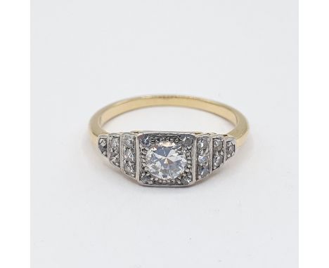 A Diamond Ring millegrain-set brilliant-cut stone with further stones to shoulders, ring size O 1/2, approx 3.10gms 