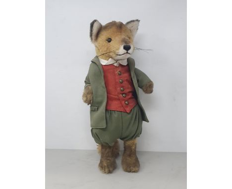 A Steiff Fox in green Jacket, Pantaloons and red Waistcoat with button in ear 14 1/2in H  Signs of old moth damagae to tail a