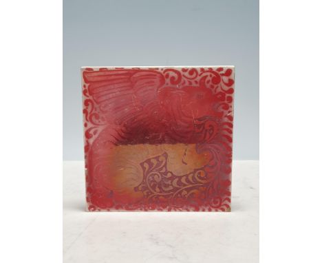 A 20th Century pottery Tile in the style of William de Morgan with ruby Lustre kylin design, 6 in square. 