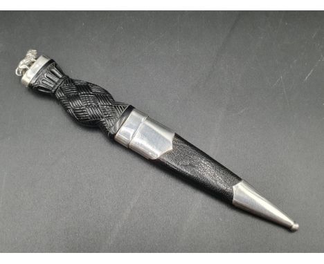 A Scottish silver mounted Sgian-dubh with basket weave decorated grip and silver lion finial, Edinburgh 1953, maker: Robert A