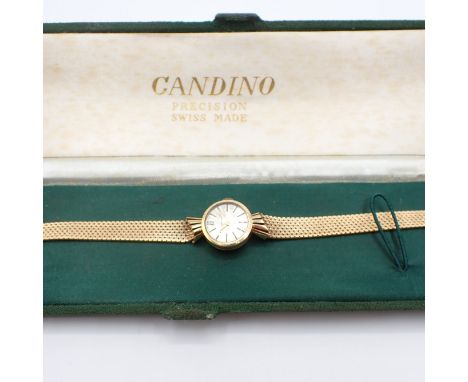 A lady's Candino manual wind Wristwatch the silvered dial with hourly baton markers in 18ct gold case on 18ct gold flexible l