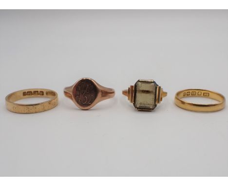 A 22ct gold Wedding Band approx 2.40gms, an 18ct gold Wedding Band 2.50gms, a Signet Ring amd a Dress Ring set smoky quartz i