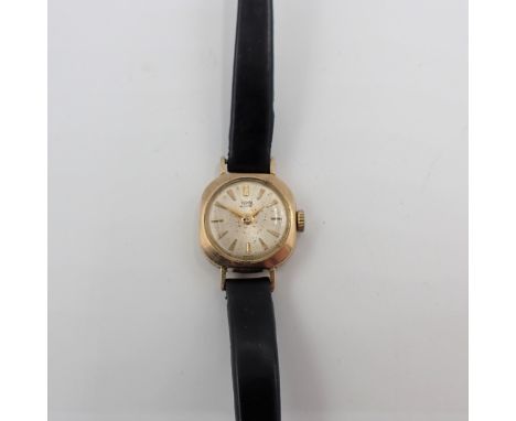 A lady's Tudor Royal manual wind Wristwatch the champagne dial with hourly baton markers in 9ct gold case marked 'for Rolex',