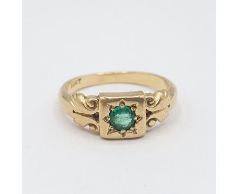 An Emerald single stone Ring set round stone in square frame, stamped 18ct, ring size L 
