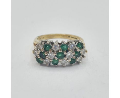 An Emerald and Diamond Cluster Ring peg-set three rows of alternating round emeralds and brilliant-cut diamonds in 18ct gold,