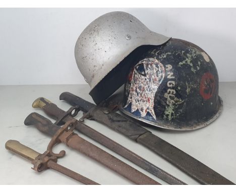 Two Gras Bayonets, one with scabbard, another Bayonet in leather Scabbard, a Spike Bayonet, an American WWII Helmet and a Ger