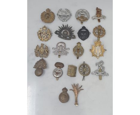 Nineteen Military Cap Badges including N.A.A.F.I., Hampshire Regiment, Royal West Kent Regiment, Royal Engineers, Army Cateri
