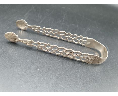 A pair of Georgian silver Sugar Tongs of pierced Chippendale design, engraved EC over EC 1777, maker: IS 