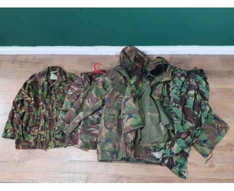 Three British Army camouflage Combat Jackets, a waterproof Jacket and a pair of Trousers 