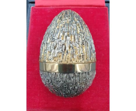 A Stuart Devlin silver-gilt limited edition Egg with bark effect textured finish enclosing a mouse amongst a wedge of cheese,