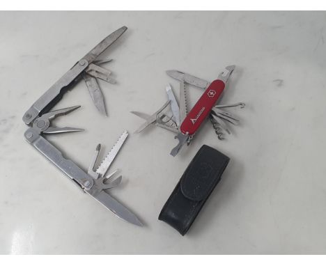 A Swiss Army 'Camping' multi-tool Penknife and a Leatherman 'Supertool' multitool Pocketknife 