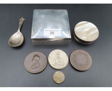 A George V silver square Cigarette Box, London 1919, a Caddy Spoon, Sheffield 1938, a white metal circular Box with inset mot