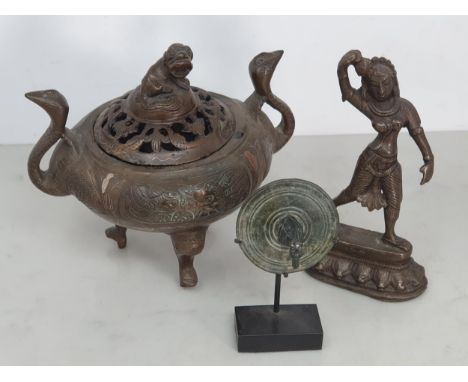 A Chinese bronze two handled Censor the handles in the form of Bird heads, the pierced lid with Dog of Fo finial, the body wi