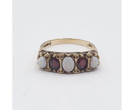 An Opal and Garnet five stone Ring set three graduated oval opal cabochons interspersed with two oval-cut garnets in 9ct gold