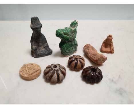A box containing an Oriental Tile Finial, loom weights, etc 