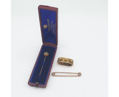 A Victorian gold Cravat or Scarf Clip with rosettes to front, unmarked, untested, a Pin marked 9ct and a Stick Pin set seed p