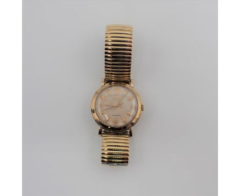 A gentleman's 1950's Rolex Precision Wristwatch the textured dial with coronet at 12, arabic numerals at 3, 6 and 9, the rema