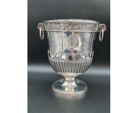 A George III silver Wine Cooler with fruiting vine friezes, leafage scroll and ring handles, semi-gadrooned, engraved two coa