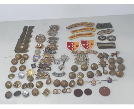 A quantity of mainly British Army Buttons, Shoulder Badges and other Badges including 'The King's Own Lancaster Regiment', 'W