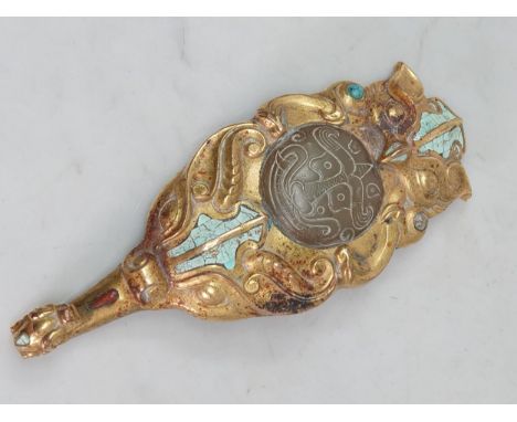 An Oriental gilt metal Belt Hook or Clothes Fastener in the form of an Owl, with coloured stone mounts, large central jade ty