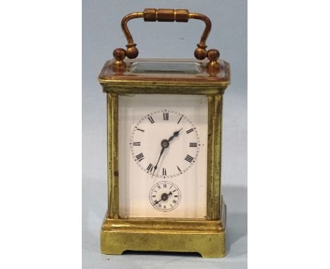 A late-19th/early-20th century brass miniature carriage alarm clock, the white enamel face with dial and alarm subsidiary, 10