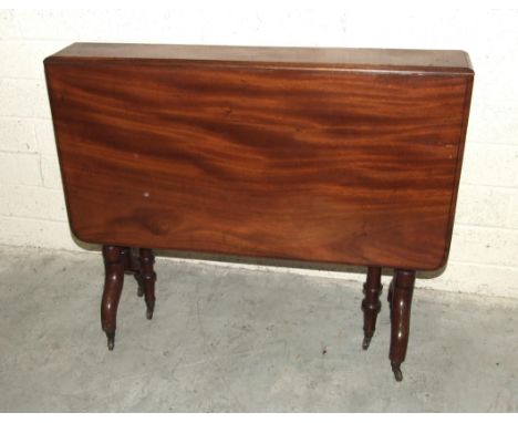 A Victorian mahogany drop-leaf Sutherland table on turned supports and gate legs, 89cm wide, 104cm open. 